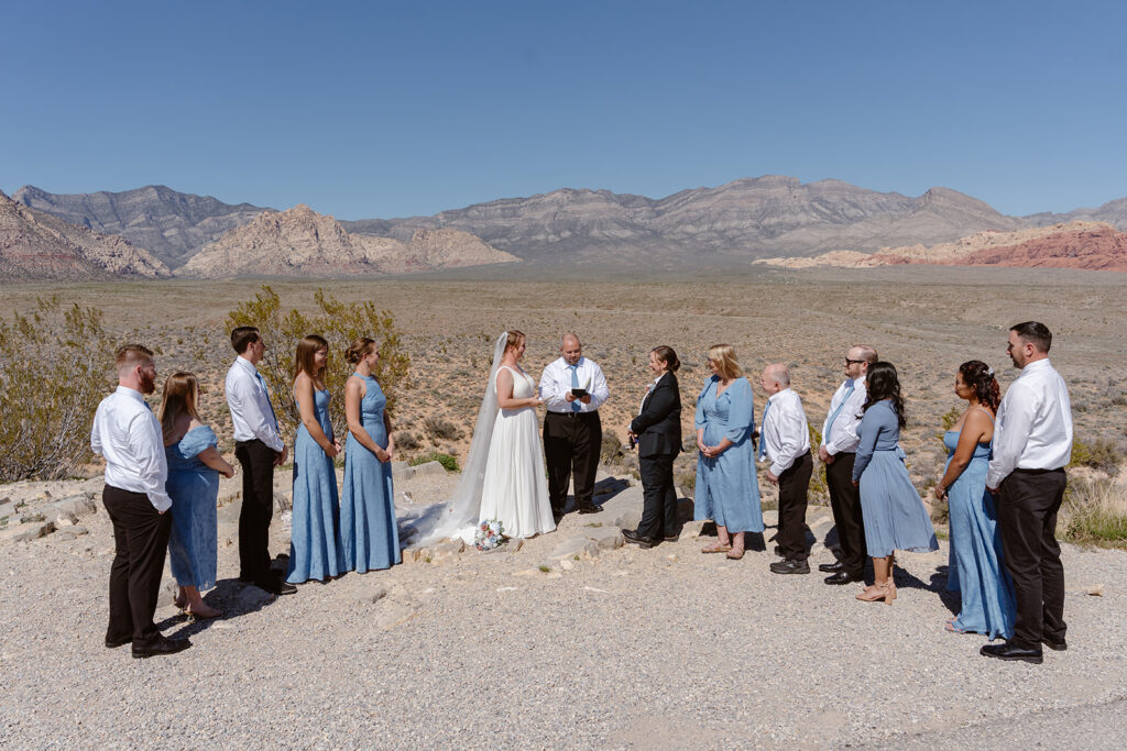 A lesbian couple says their vows in front of loved ones in red rock canyon