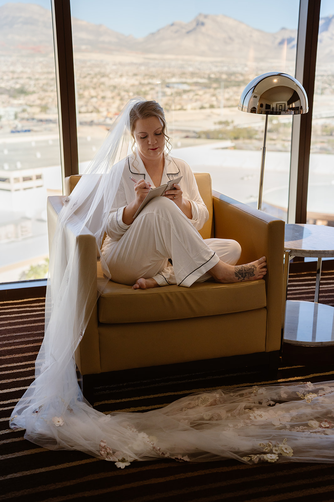 a bride writes her vows in her hotel room